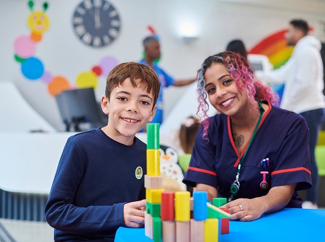 boy and nurse smiling