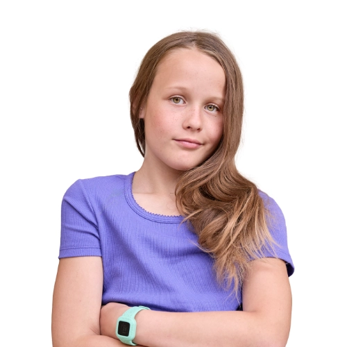 Portrait of Emmy, an 11-year-old girl in a purple shirt smiling softly against a light background